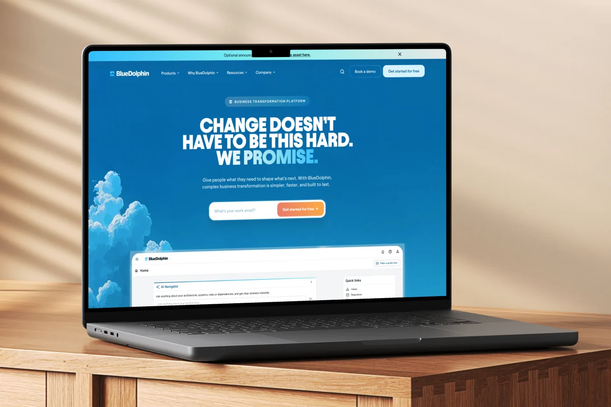A laptop showing a homepage headline, “Change doesn’t have to be this hard”
